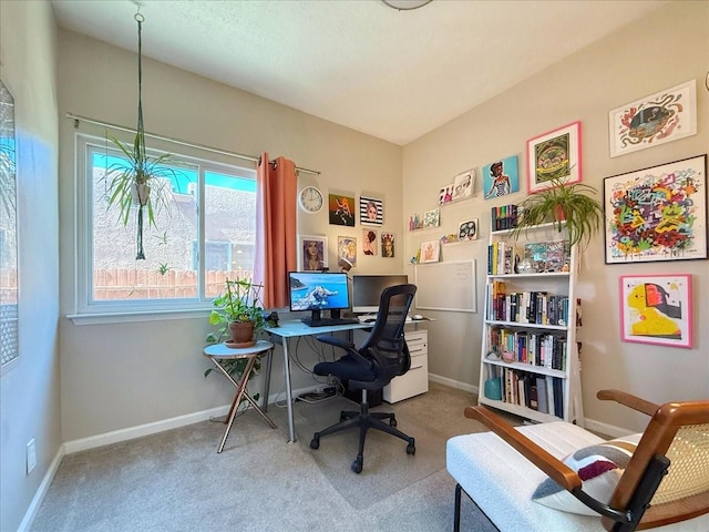 home office with baseboards and carpet floors