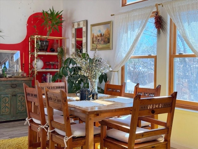 dining area with wood finished floors