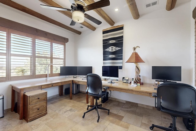 office space featuring beam ceiling, stone finish floor, visible vents, and ceiling fan