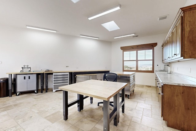 dining room with visible vents and stone tile flooring