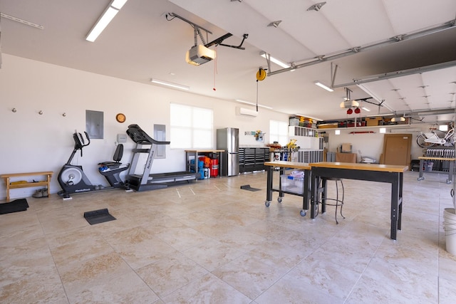 garage with electric panel, a workshop area, a garage door opener, and freestanding refrigerator