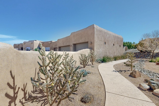 view of side of property featuring stucco siding