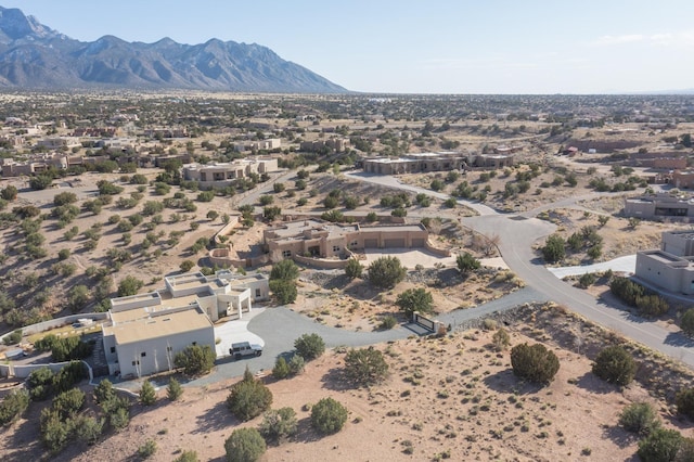 bird's eye view with a desert view and a mountain view