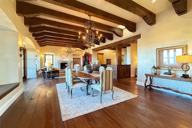 dining room with dark wood-type flooring, a fireplace, and baseboards