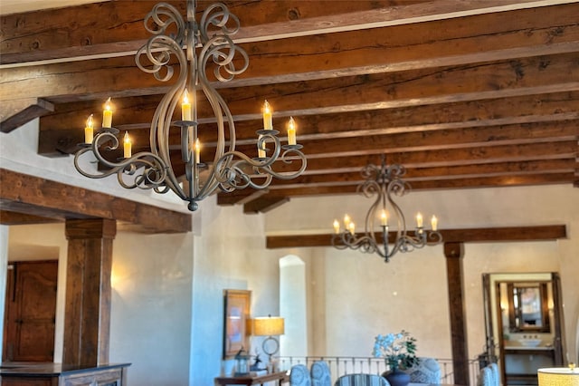 room details featuring a notable chandelier and beamed ceiling