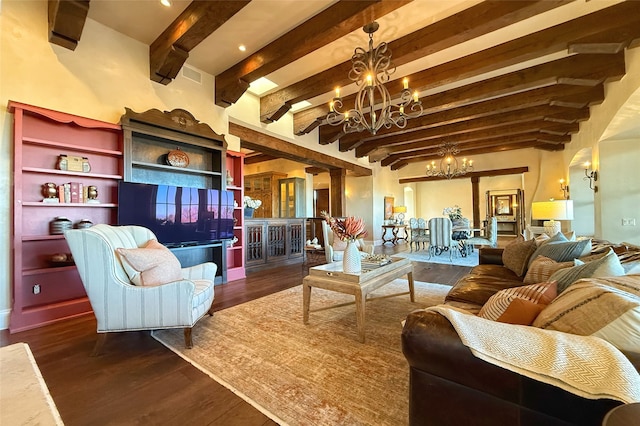 living room featuring beam ceiling, visible vents, an inviting chandelier, and wood finished floors