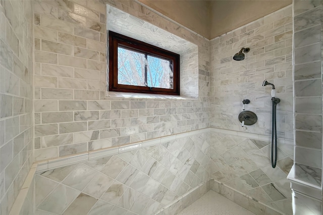 full bath featuring a tile shower