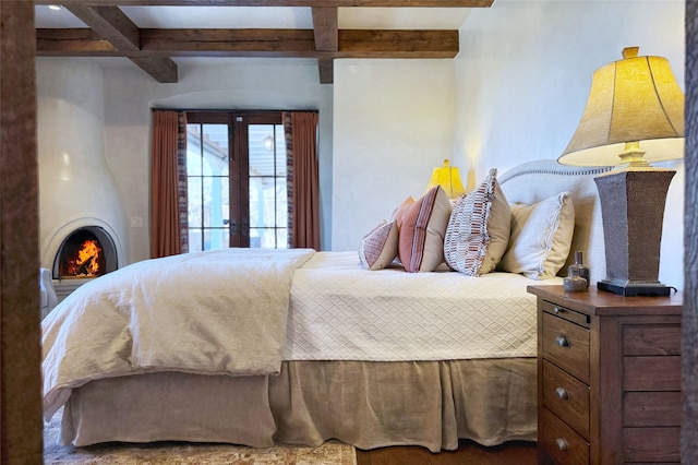 bedroom with beam ceiling, french doors, and coffered ceiling