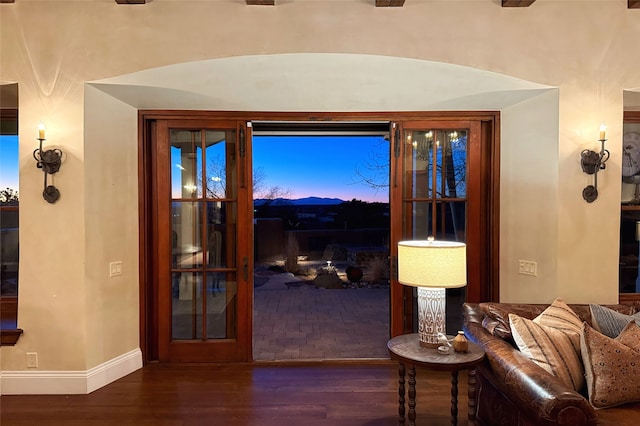 interior space featuring wood finished floors and baseboards