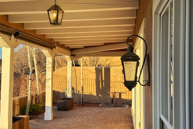 view of patio featuring fence