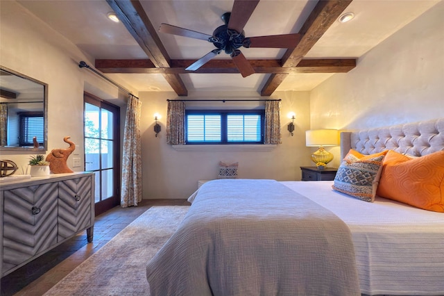 bedroom featuring beam ceiling and multiple windows