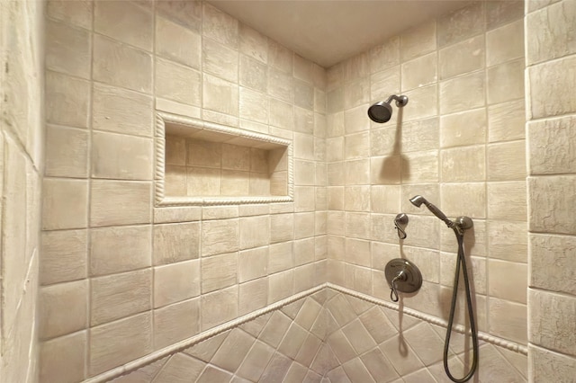 full bath featuring tiled shower