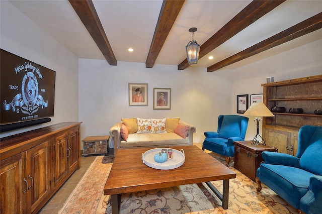 living area featuring recessed lighting and beam ceiling