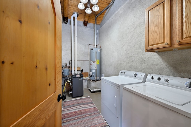 laundry room with independent washer and dryer, gas water heater, cabinet space, wood ceiling, and a heating unit