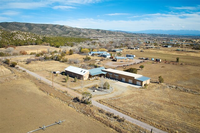 drone / aerial view with a mountain view and a rural view