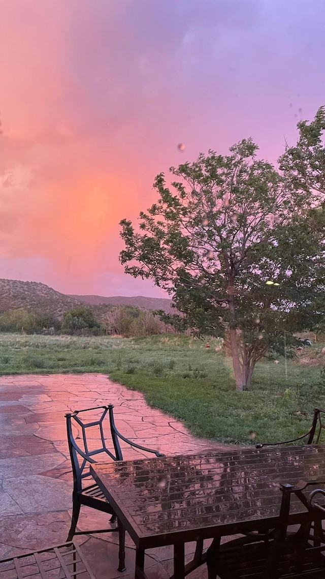 view of patio terrace at dusk