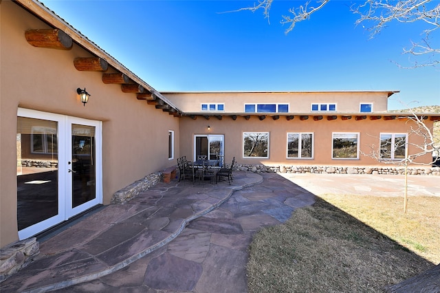 view of patio featuring outdoor dining space and french doors