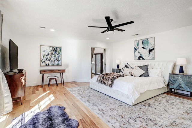 bedroom featuring recessed lighting, wood finished floors, visible vents, and baseboards