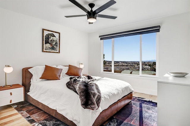 bedroom featuring wood finished floors and a ceiling fan