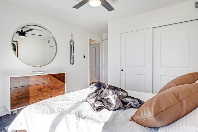 bedroom featuring a closet, visible vents, and ceiling fan