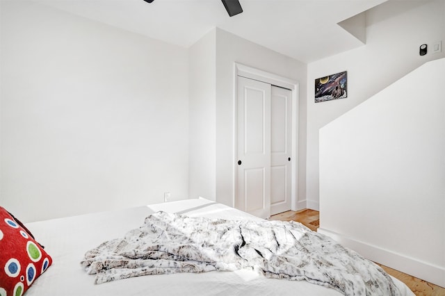 bedroom featuring a closet, ceiling fan, and baseboards