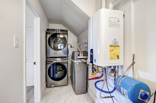 clothes washing area with water heater, stacked washer / dryer, and marble finish floor