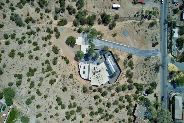 birds eye view of property featuring view of desert