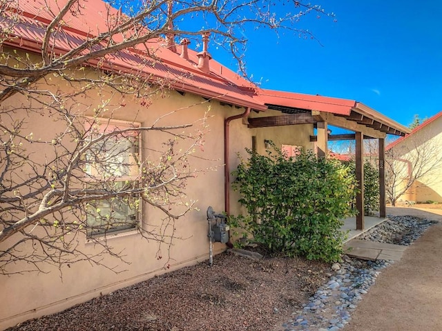 view of property exterior with stucco siding