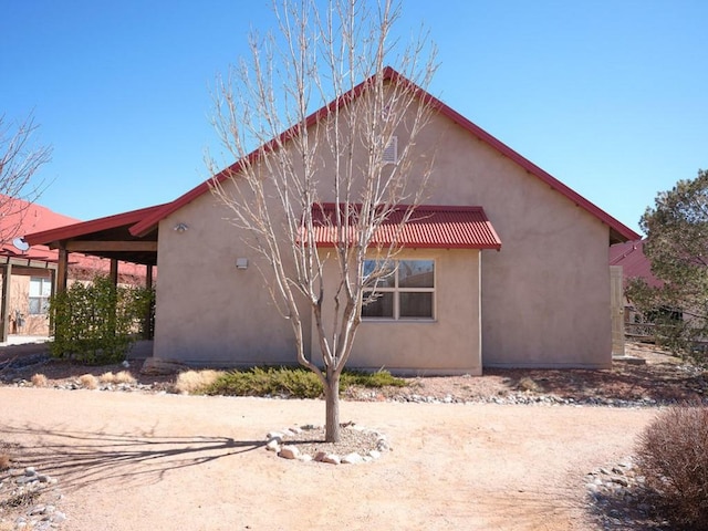 back of property with stucco siding