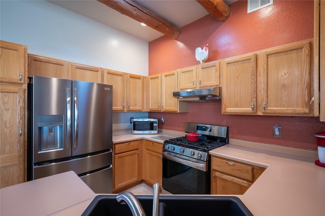 kitchen featuring visible vents, beamed ceiling, under cabinet range hood, stainless steel appliances, and light countertops