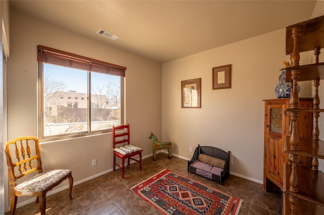 sitting room featuring visible vents and baseboards