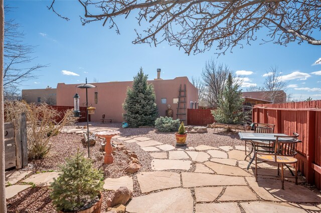 view of patio featuring fence