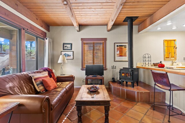 kitchen featuring tile countertops, visible vents, beam ceiling, white electric range, and open floor plan