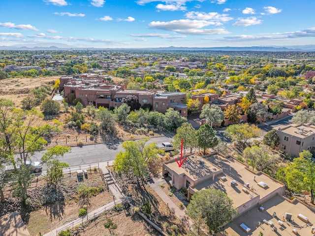 birds eye view of property with a mountain view