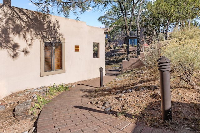 view of side of property with stucco siding