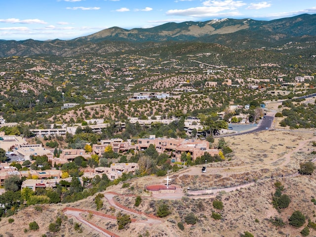 birds eye view of property with a mountain view