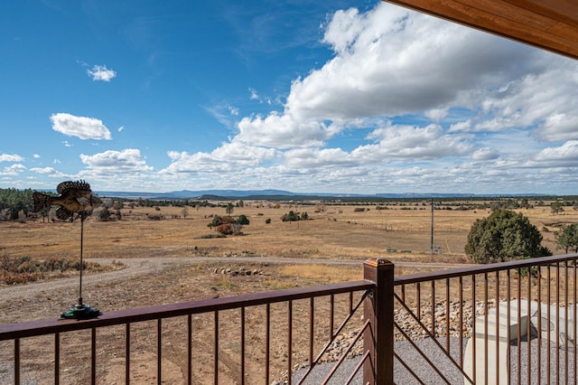 balcony featuring a rural view