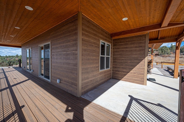 wooden deck with a patio