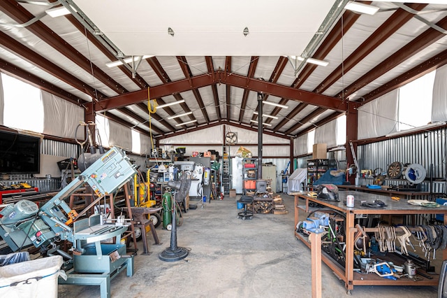 garage with a workshop area and metal wall