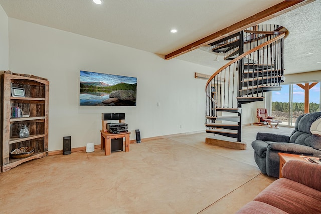 living area featuring a textured ceiling, finished concrete flooring, recessed lighting, baseboards, and stairs