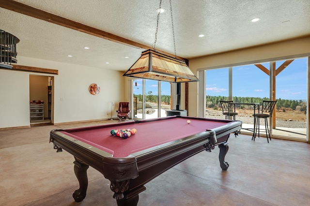 playroom with pool table, finished concrete flooring, and a textured ceiling