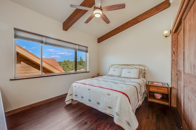 bedroom with vaulted ceiling with beams, wood finished floors, baseboards, and ceiling fan