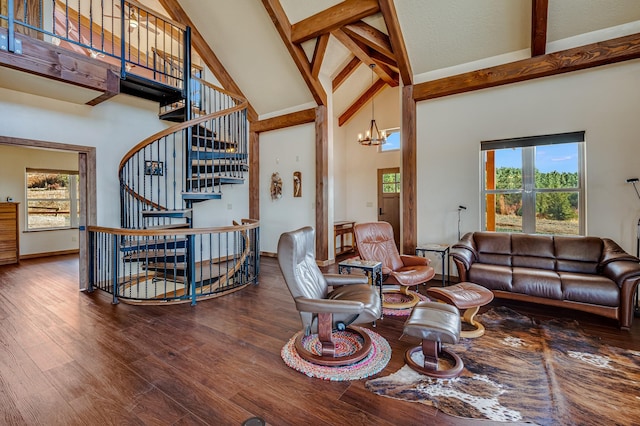 living area featuring a chandelier, stairway, beam ceiling, wood finished floors, and high vaulted ceiling