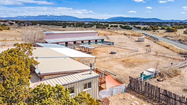 birds eye view of property featuring a mountain view