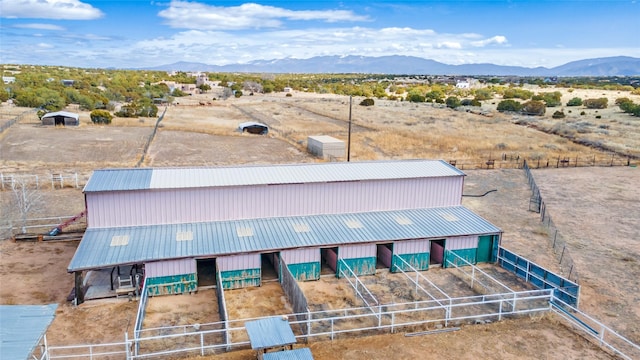 birds eye view of property with a mountain view