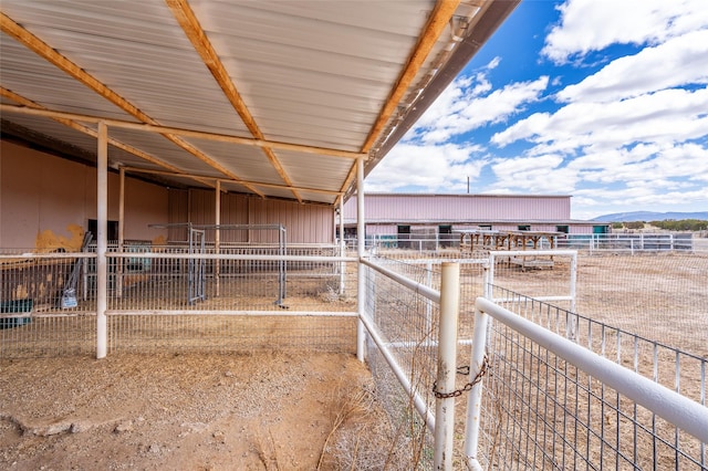 view of stable with a mountain view