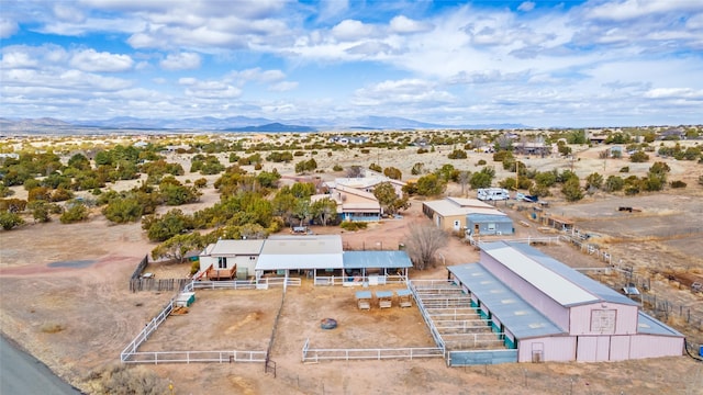 birds eye view of property with view of desert and a mountain view