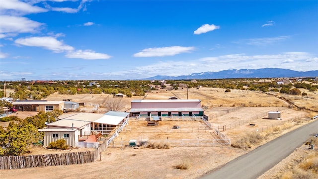 birds eye view of property featuring a mountain view