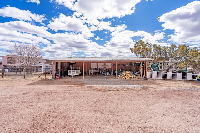 view of outbuilding with an outdoor structure and a carport