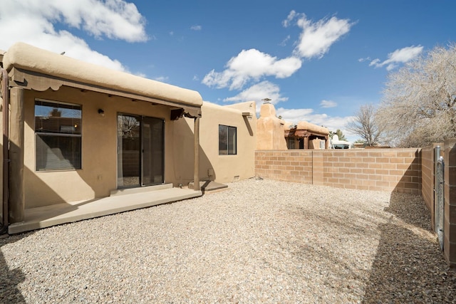 back of house featuring a patio and fence